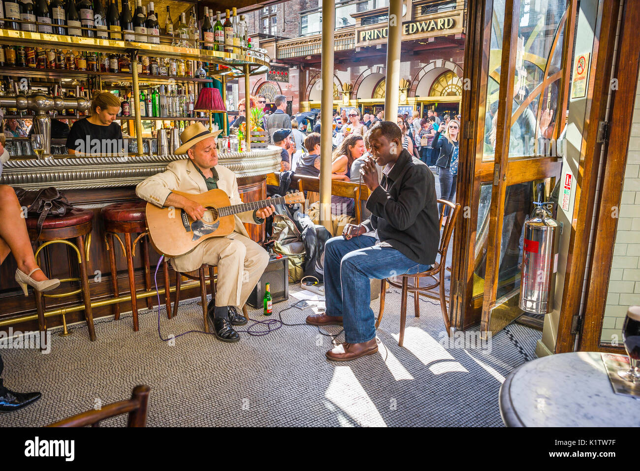 Soho London pub, two blues musicians perform inside the Cafe Boheme in Old Compton Street on a summer afternoon, Soho, London, UK. Stock Photo