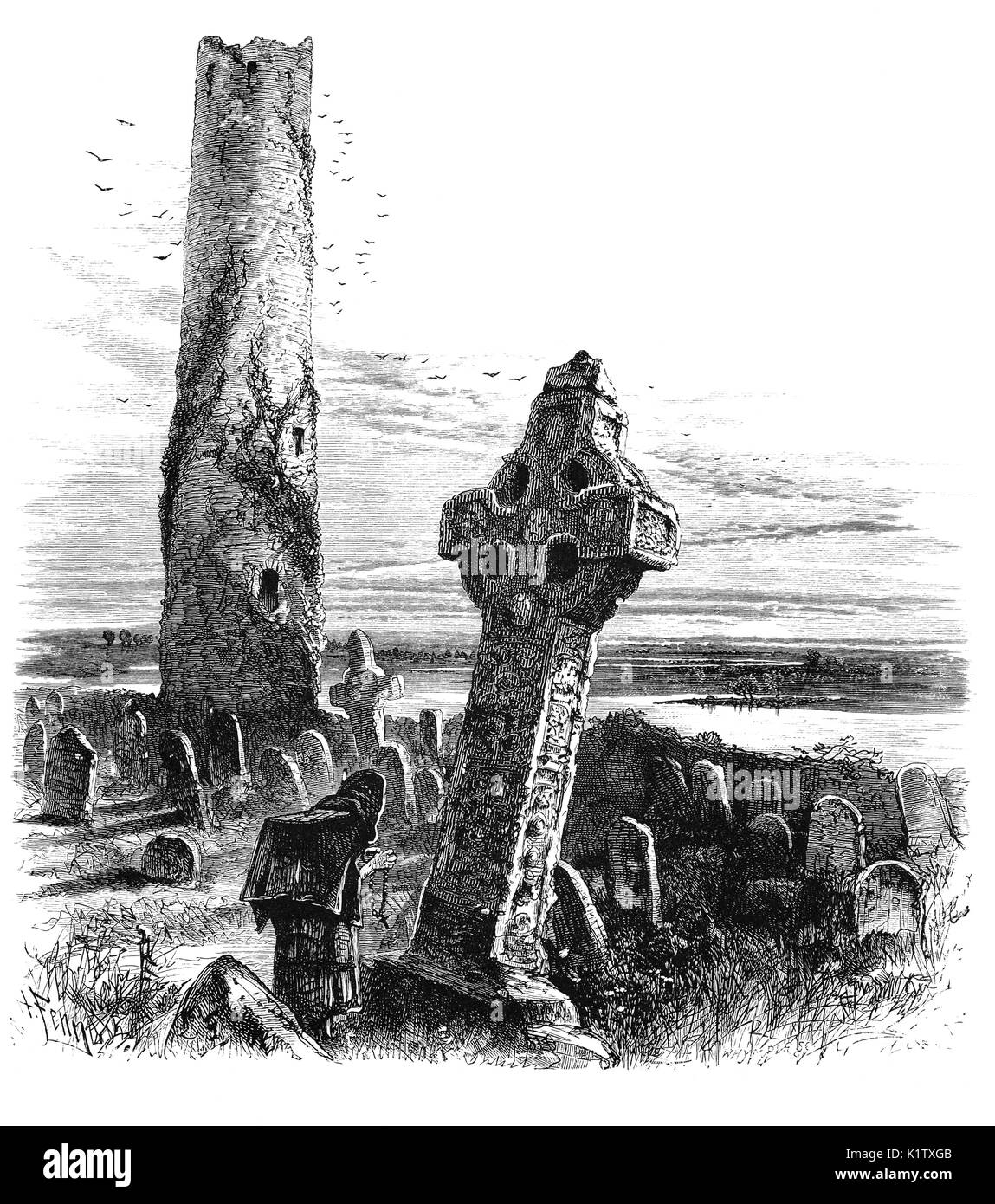 1870: An ancient round tower and high cross overlooking the River Shannon,from Saint Kieron's 6th Century monastic site at Clonmacnoise, County Offaly, Ireland Stock Photo