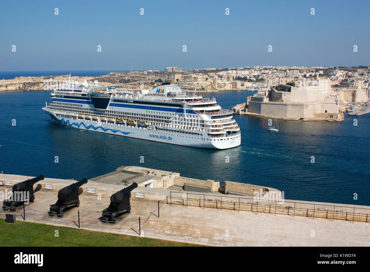 Mediterranean travel and tourism. The cruise ship or liner AIDAstella departing from the Grand Harbour in Malta Stock Photo