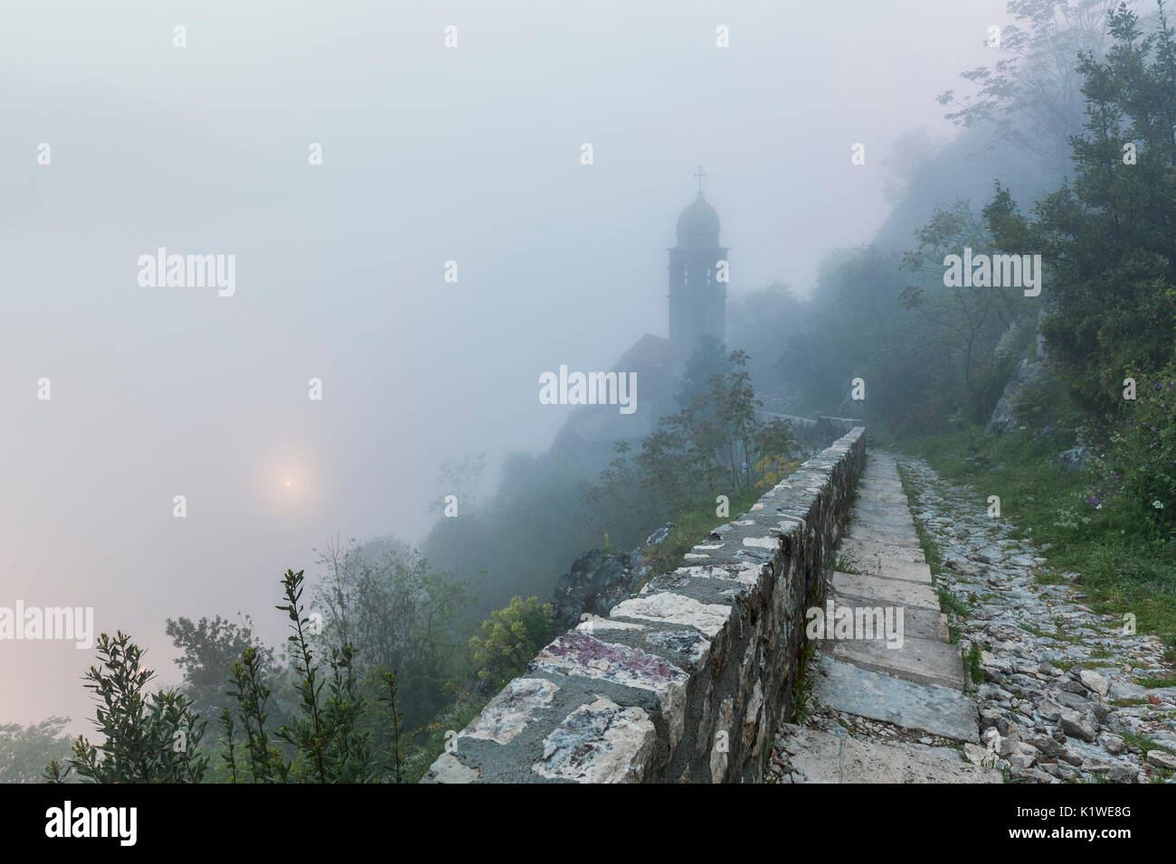 Fortifications of Kotor, part of the Natural and Culturo-Historical Region of Kotor, Montenegro, in a foggy morning Stock Photo