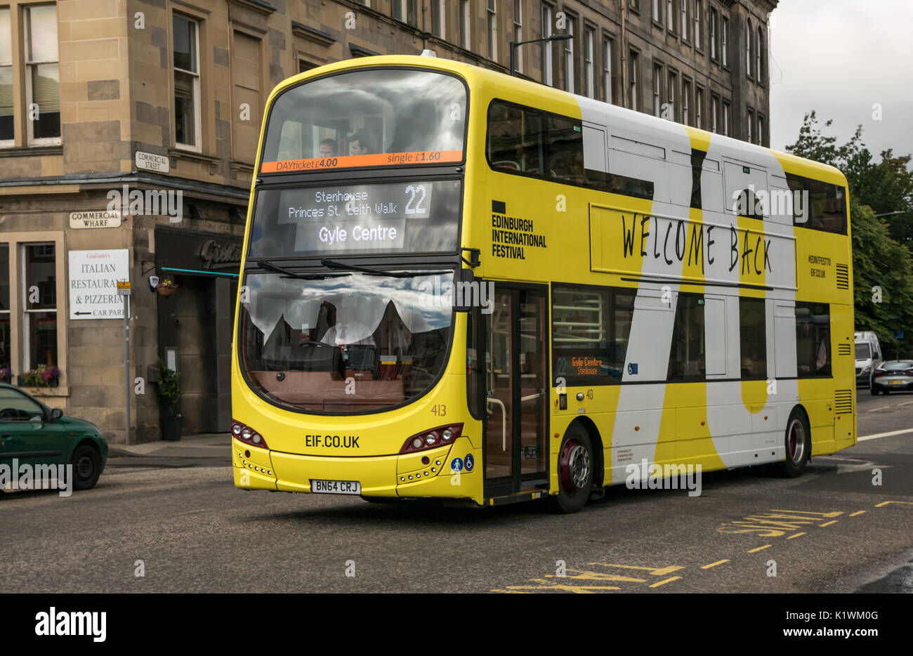 Lothian bus number 22, The Shore, Leith, Edinburgh, UK with Edinburgh International Festival 70th anniversary advertising Welcome Back slogan Stock Photo