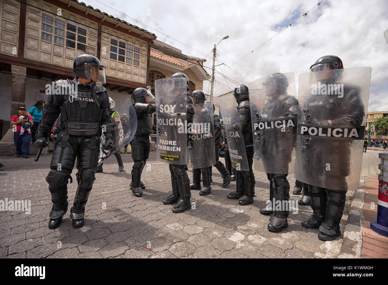 riot police in action in Cotacachi Imbabura Ecuador during inti raymi parade at summer solstice Stock Photo