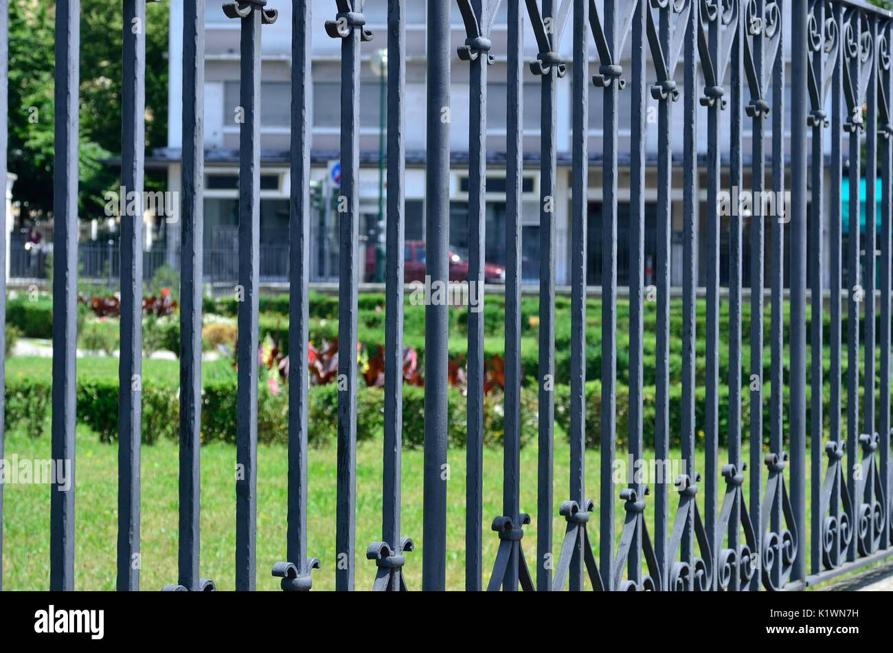 Close-up of an old style, front yard fence design, made of metal . Stock Photo