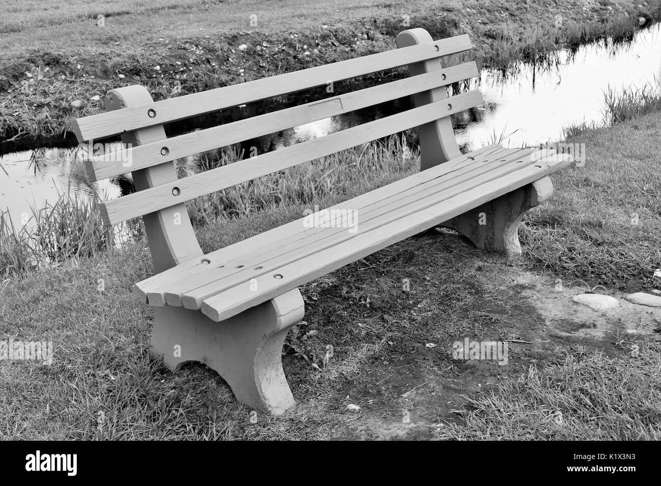 Bench Next to Stream at Kiwanis Park Stock Photo