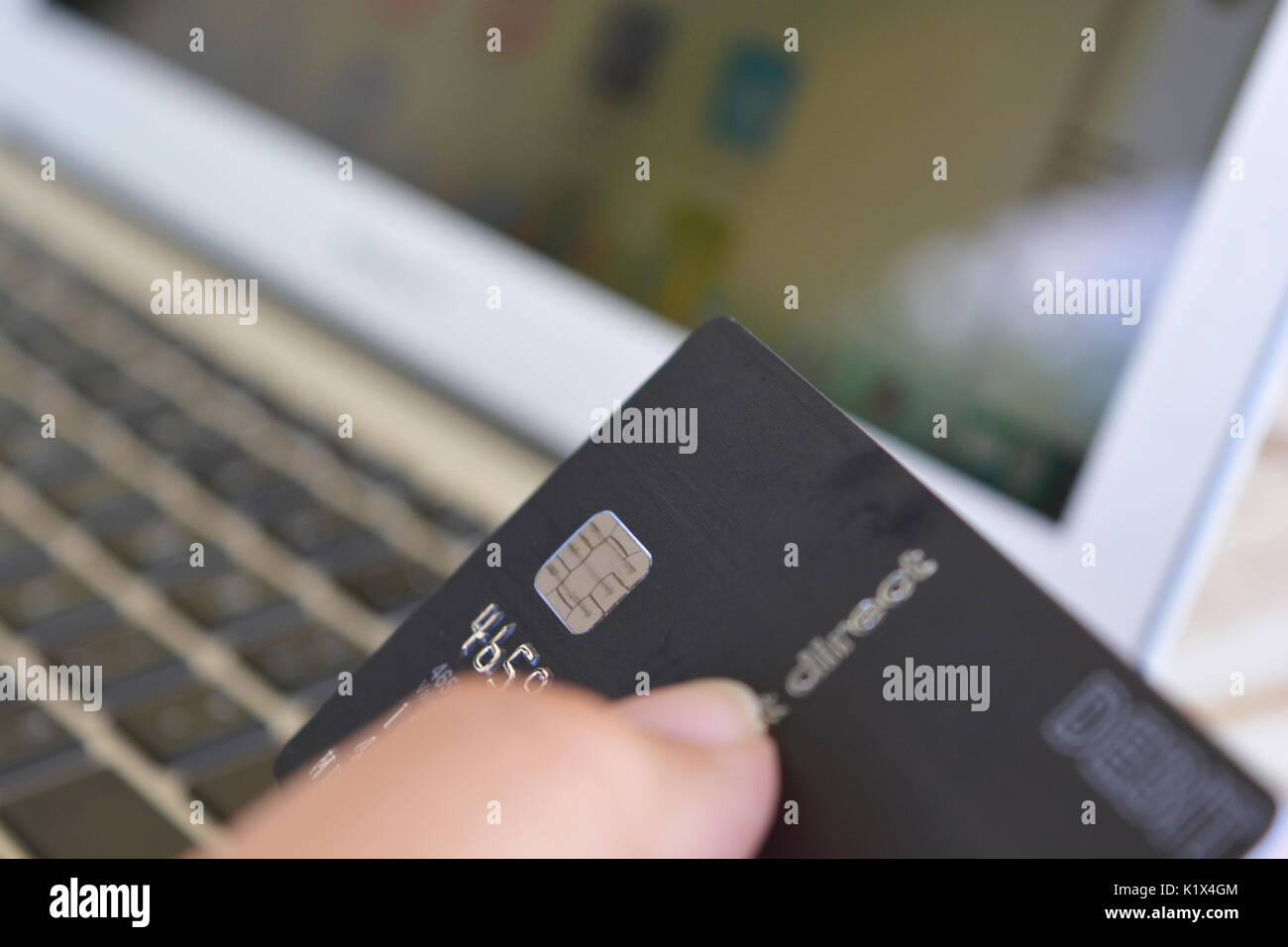 Using a visa debit card for online shopping Stock Photo Alamy