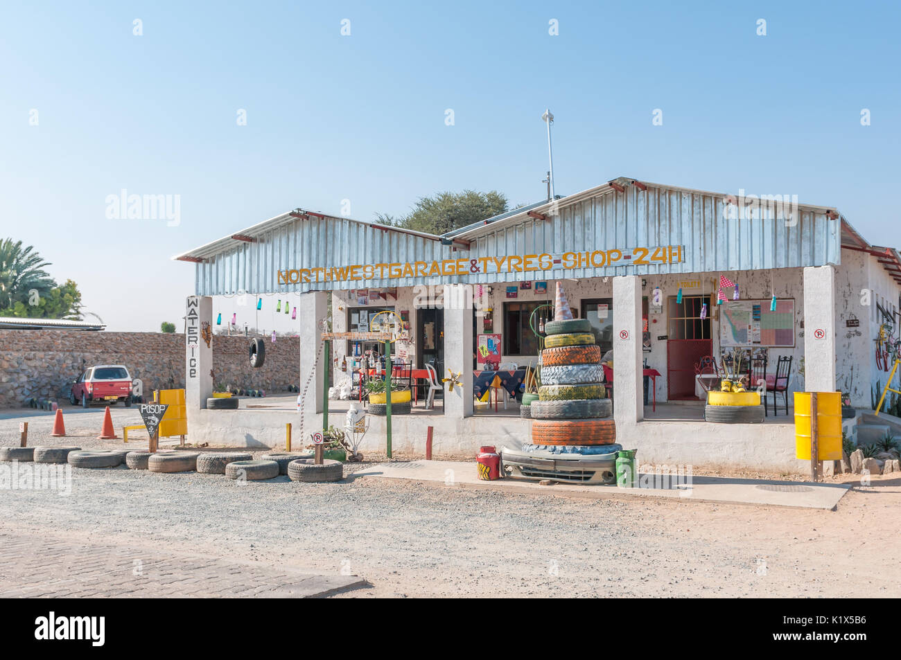 KAMANJAB, NAMIBIA - JUNE 27, 2017: A cafe and tyre shop in Kamanjab, a small town in the Kunene Region of Namibia Stock Photo