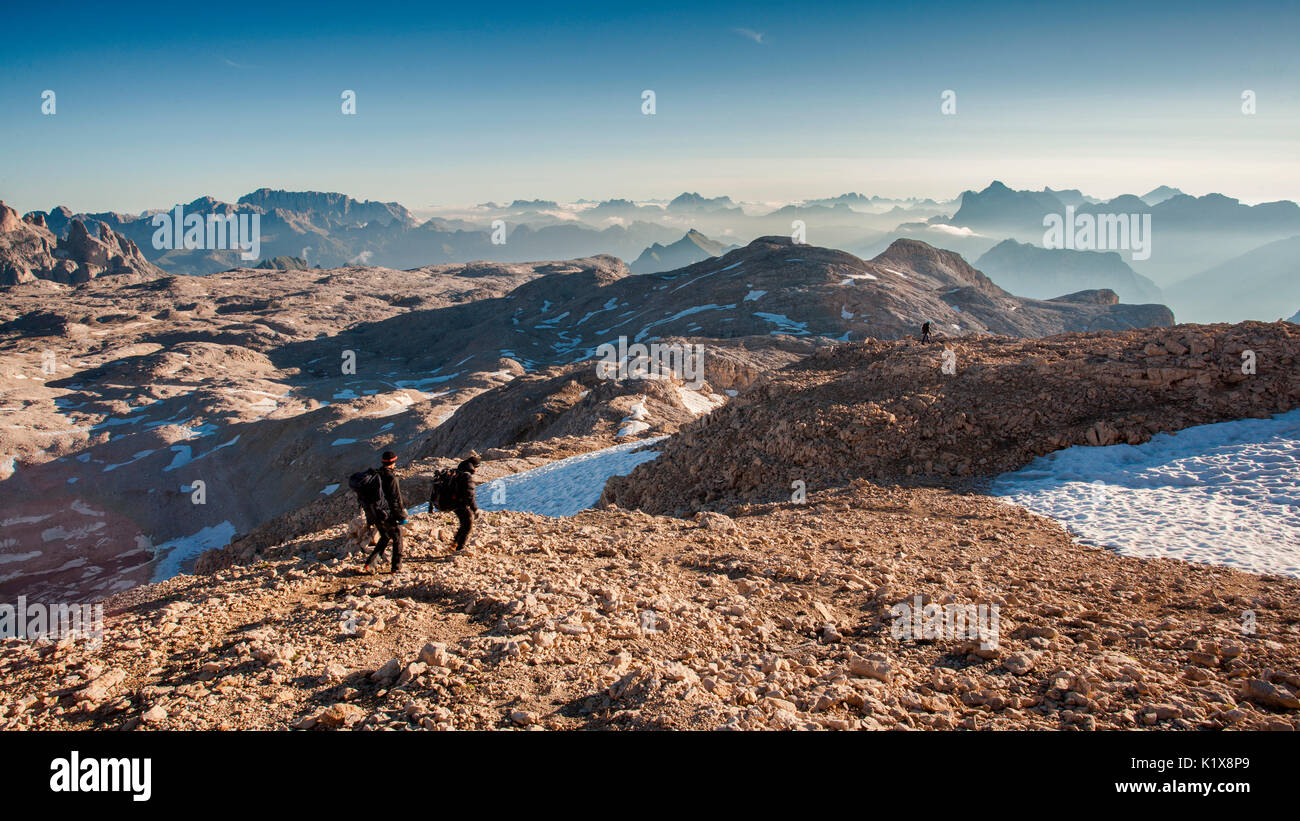 Europe, Italy, Trentino, Pale di San Martino. Hikers in the lunar landscape of the Pale di San Martino plateau Stock Photo