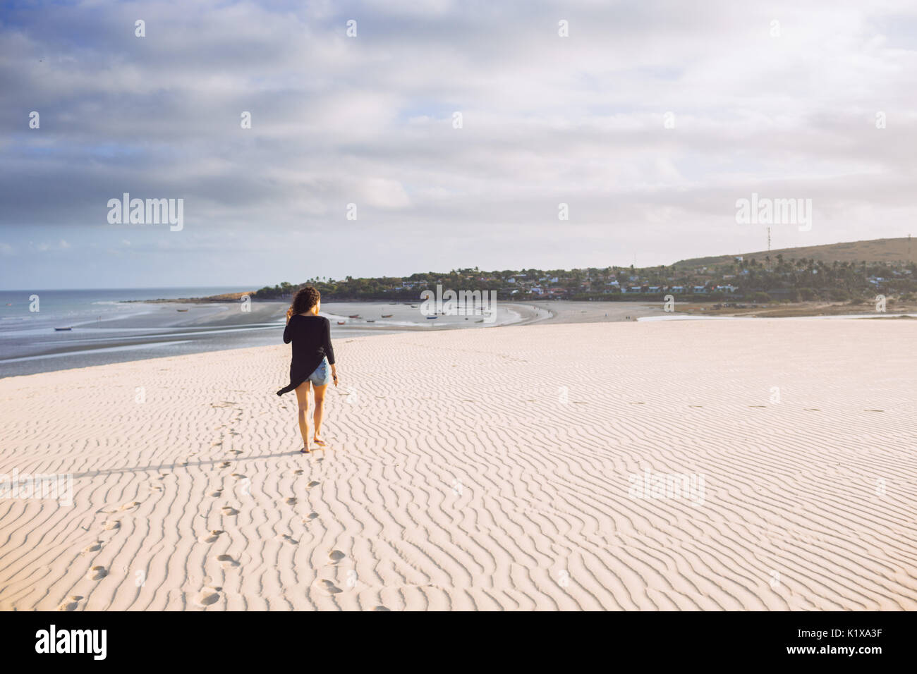 Woman walking alone hi-res stock photography and images - Alamy