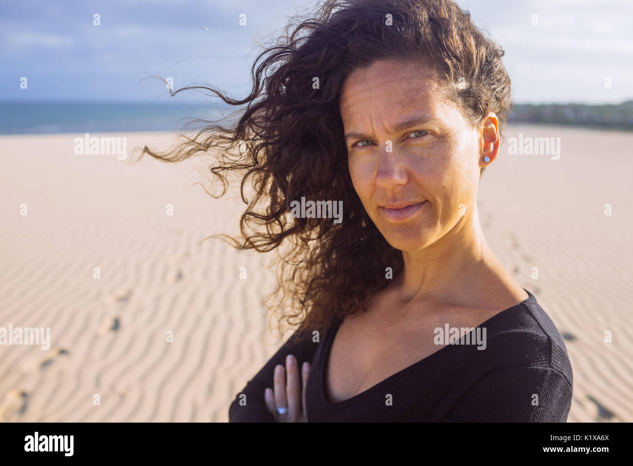 Middle Age Curly Hair White Woman Around 35 Enjoying Sunrise Or Sunset And Wind In The Dunes Of Jericoacoara Ceara Brasil Stock Photo Alamy