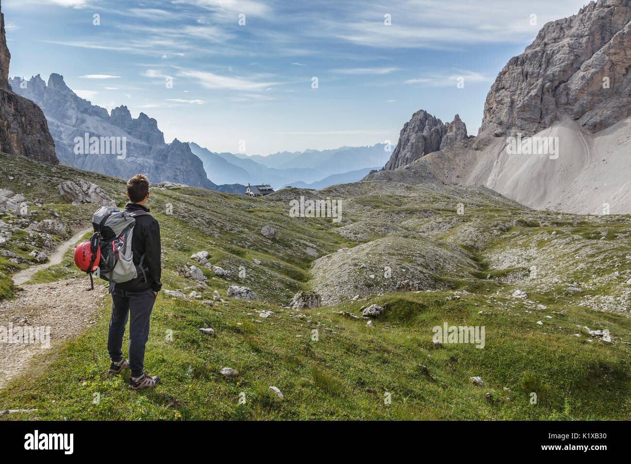 Europe, Italy, Veneto, Belluno. hiker in high Giralba valley on the way to the hut Carducci, Sexten Dolomites Stock Photo