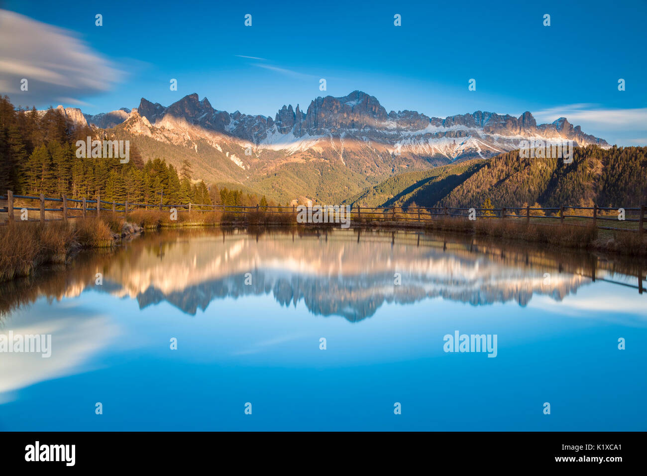Europe, Italy, Valley of Tiersertal, South Tyrol, Alto Adige, Dolomites. Reflections of Catinaccio - Rosengarten at sunset on the lake Wuhn Stock Photo