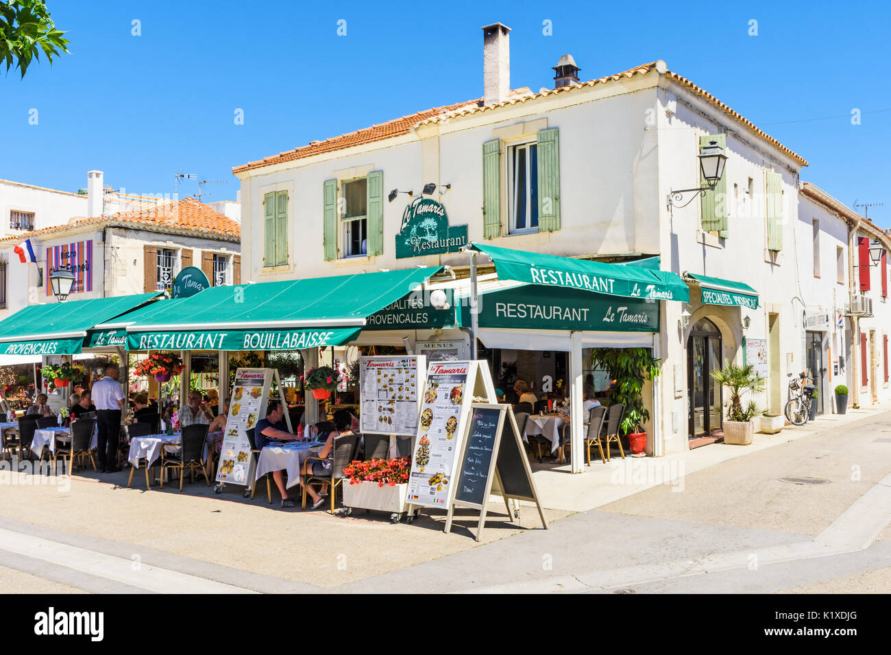 Busy restaurant in Saintes-Maries-de-la-Mer, Bouches-du-Rhône, France Stock Photo