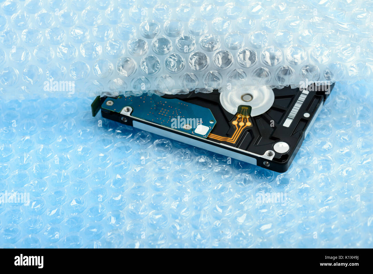 Hard disk in bubble wrap package Stock Photo