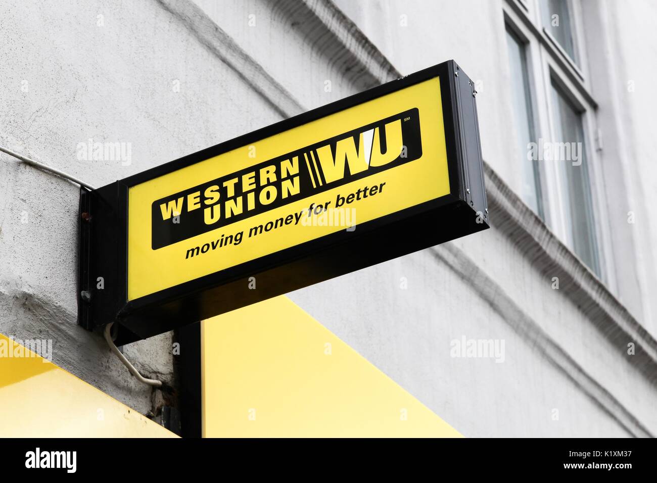 Aarhus, Denmark - July 15, 2017: Western Union sign and logo on a facade. The Western Union company is an american financial services Stock Photo