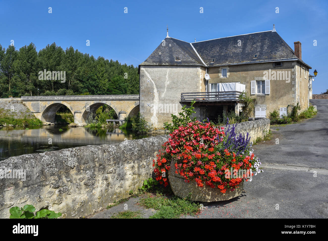 Watermill and bridge across river Gartempe, Saint-Pierre-de-Maillé, Vienne, France. Stock Photo