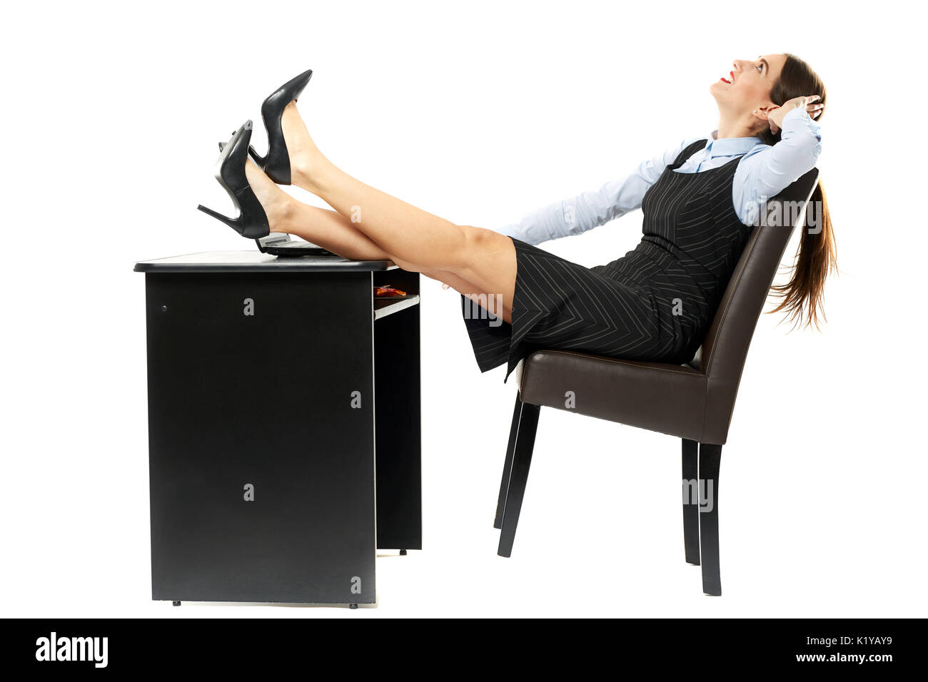 Putting your feet up businesswoman relaxing at her desk Stock Photo