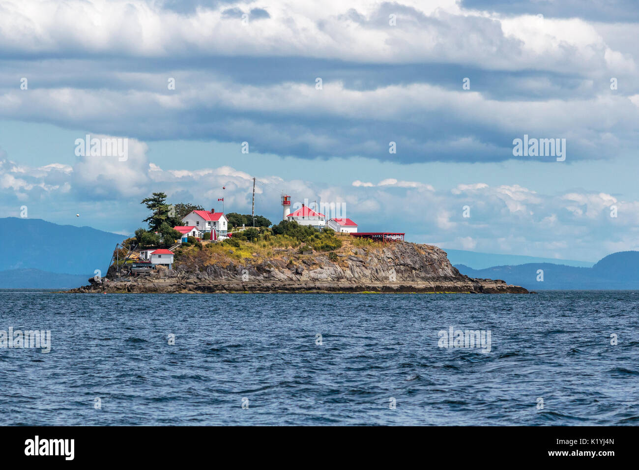 Historic Chrome Island Lightstation stands watch over the northwest corner of the Strait of Georgia, on Canada's west coast. Stock Photo