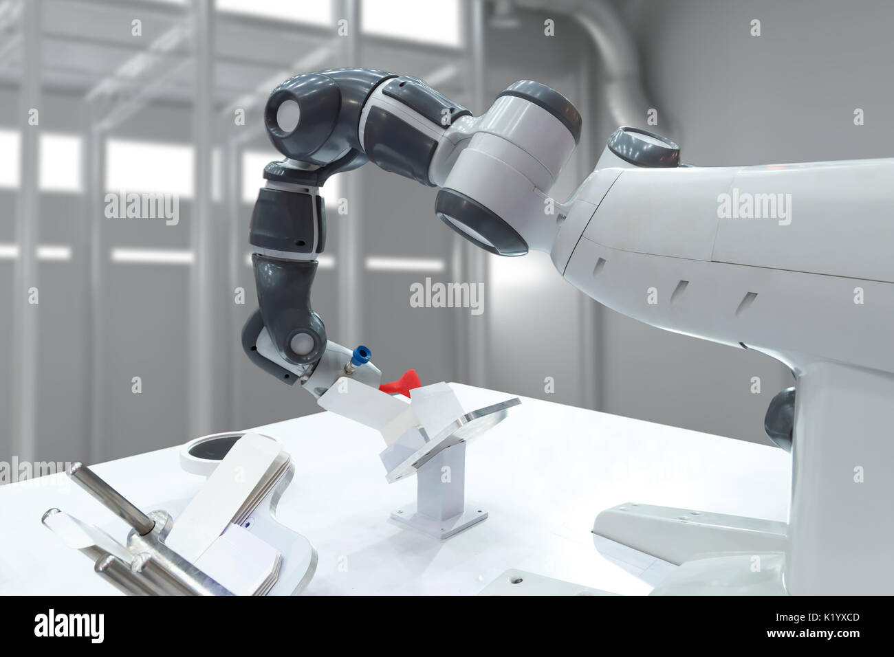 Industrial Folding box automation machine robot arm technology in smart factory. Industry 4th internet of things concept. Stock Photo