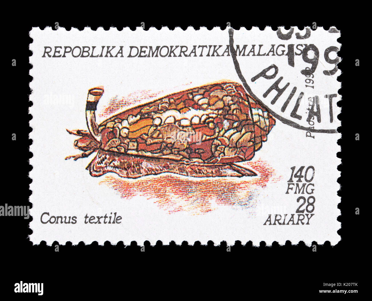 Postage stamp from Madagascar depicting a cone snail (Conus textile) Stock Photo