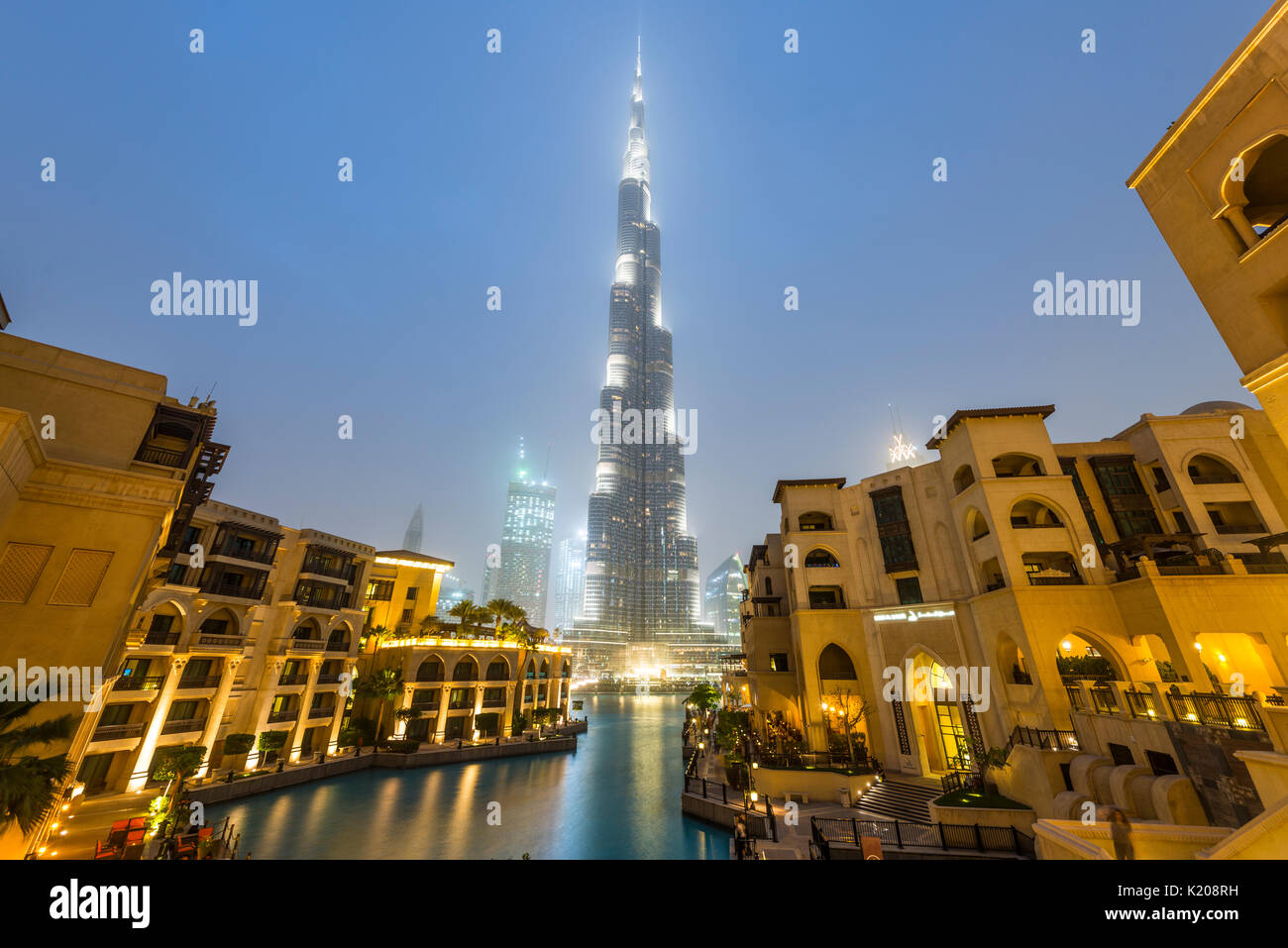Burj Khalifa, artificial lake with lighted fountain, blue hour, Dubai, Emirate Dubai, United Arab Emirates Stock Photo