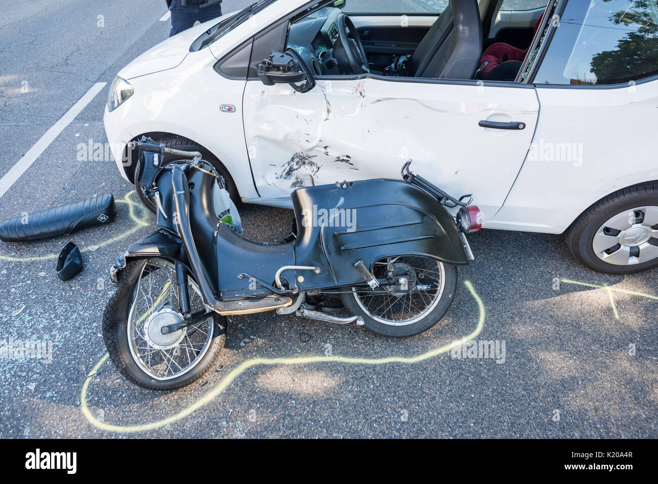 Heavy road accident, Simson scooter crashing in car, policewoman at the accident, Germany Stock Photo