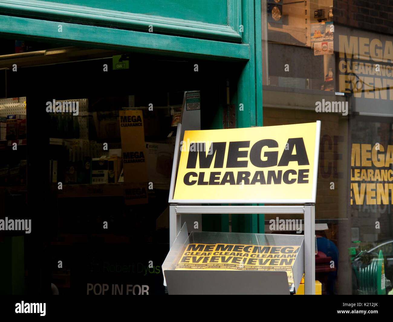 Mega Sale clearance sign outside retail store entrance Stock Photo Alamy