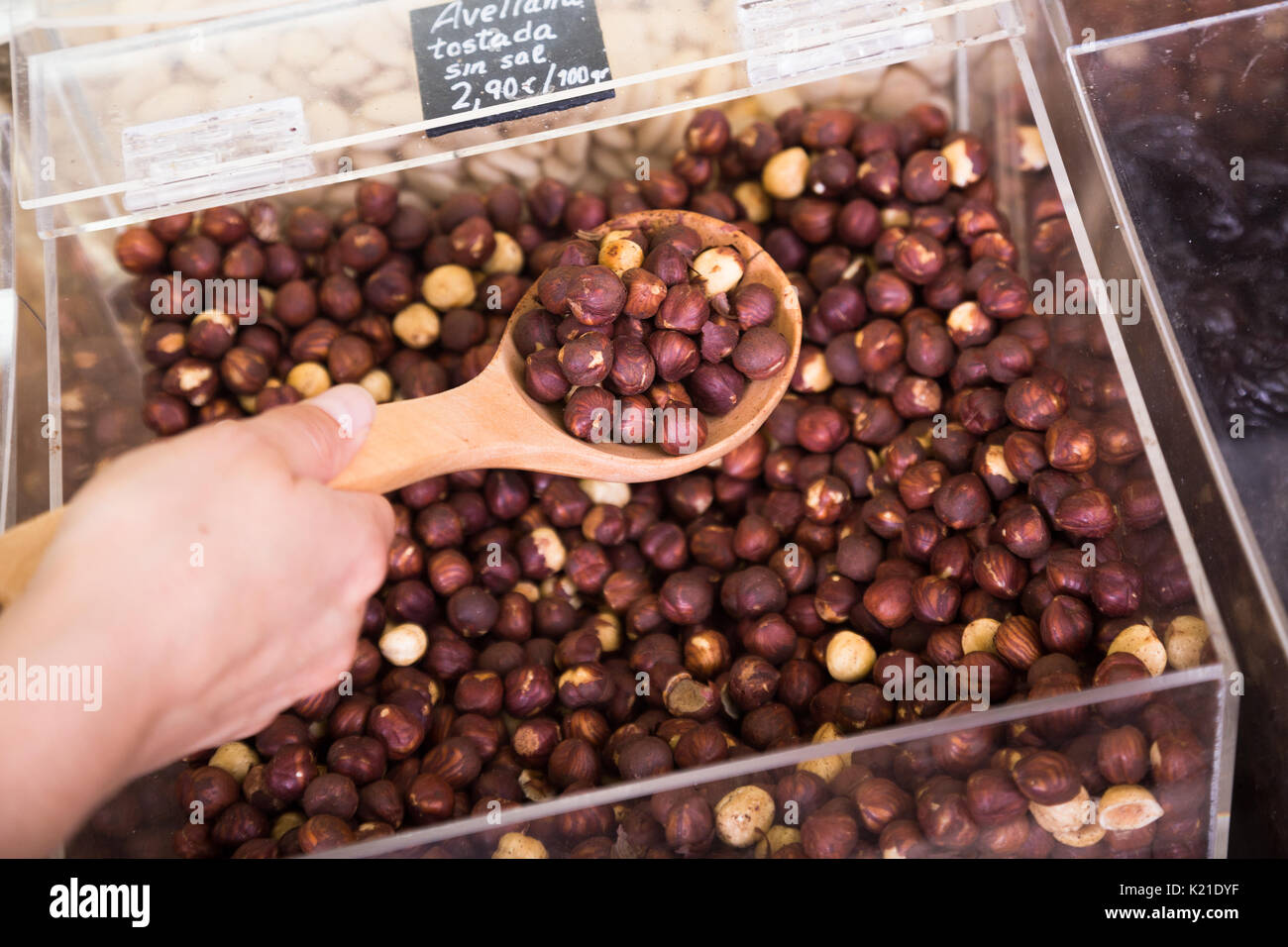 Closeup view on shelled hazelnuts selling by weight in food store Stock