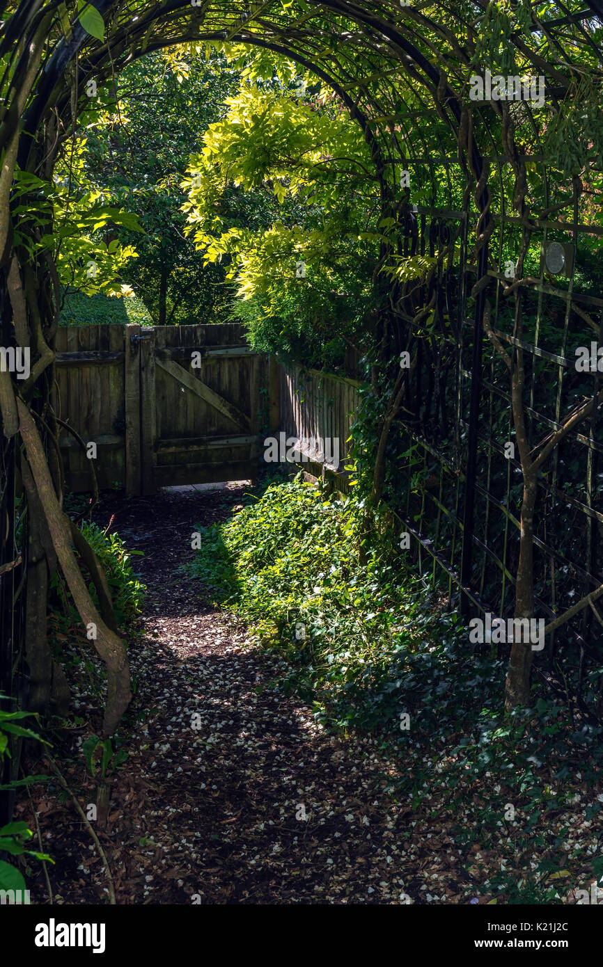 Arch and gate in the garden at Highdown Stock Photo