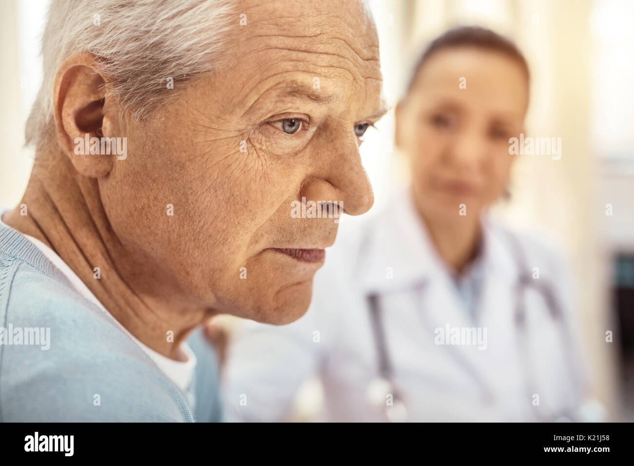 Sad cheerless man thinking about his life Stock Photo