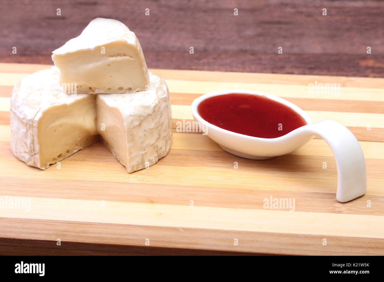 Cheese with white mold. Camembert or brie type with Cranberry sauce