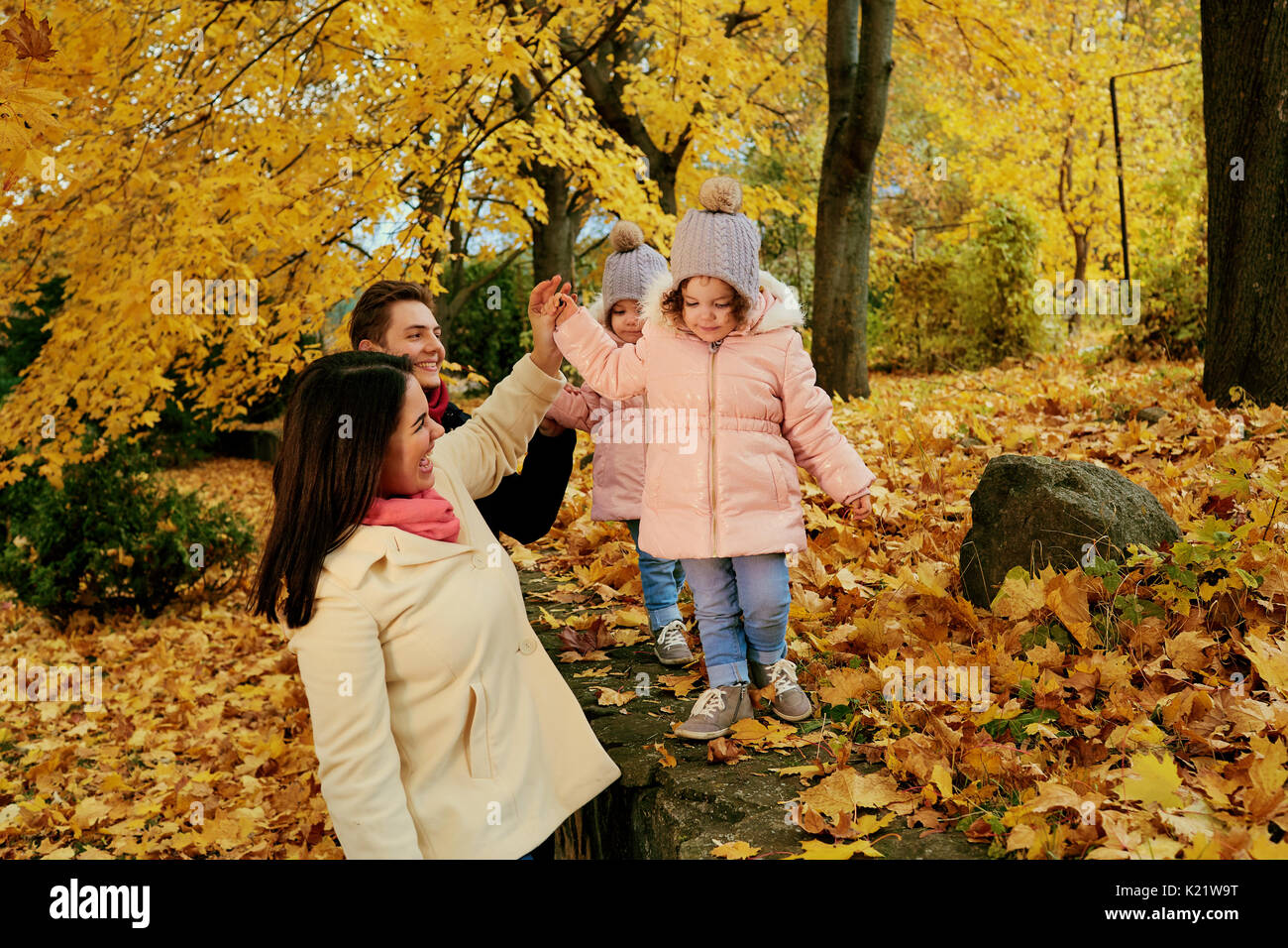 Happy family playing in the autumn in the park Stock Photo - Alamy