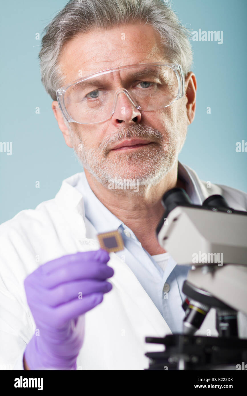 Senior life science research researching in modern scientific laboratory. Stock Photo
