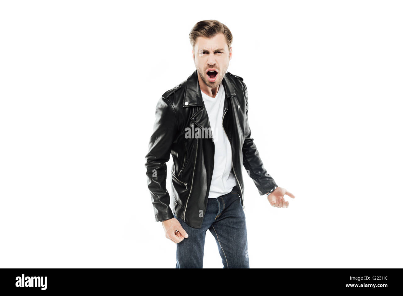 emotional man in leather jacket screaming at camera isolated on white Stock Photo