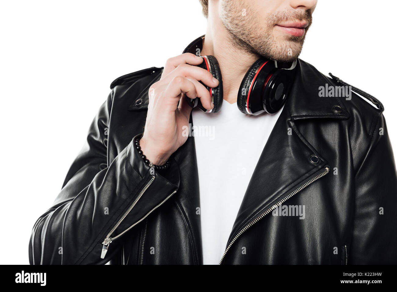 partial view of man in leather jacket with headphones isolated on white