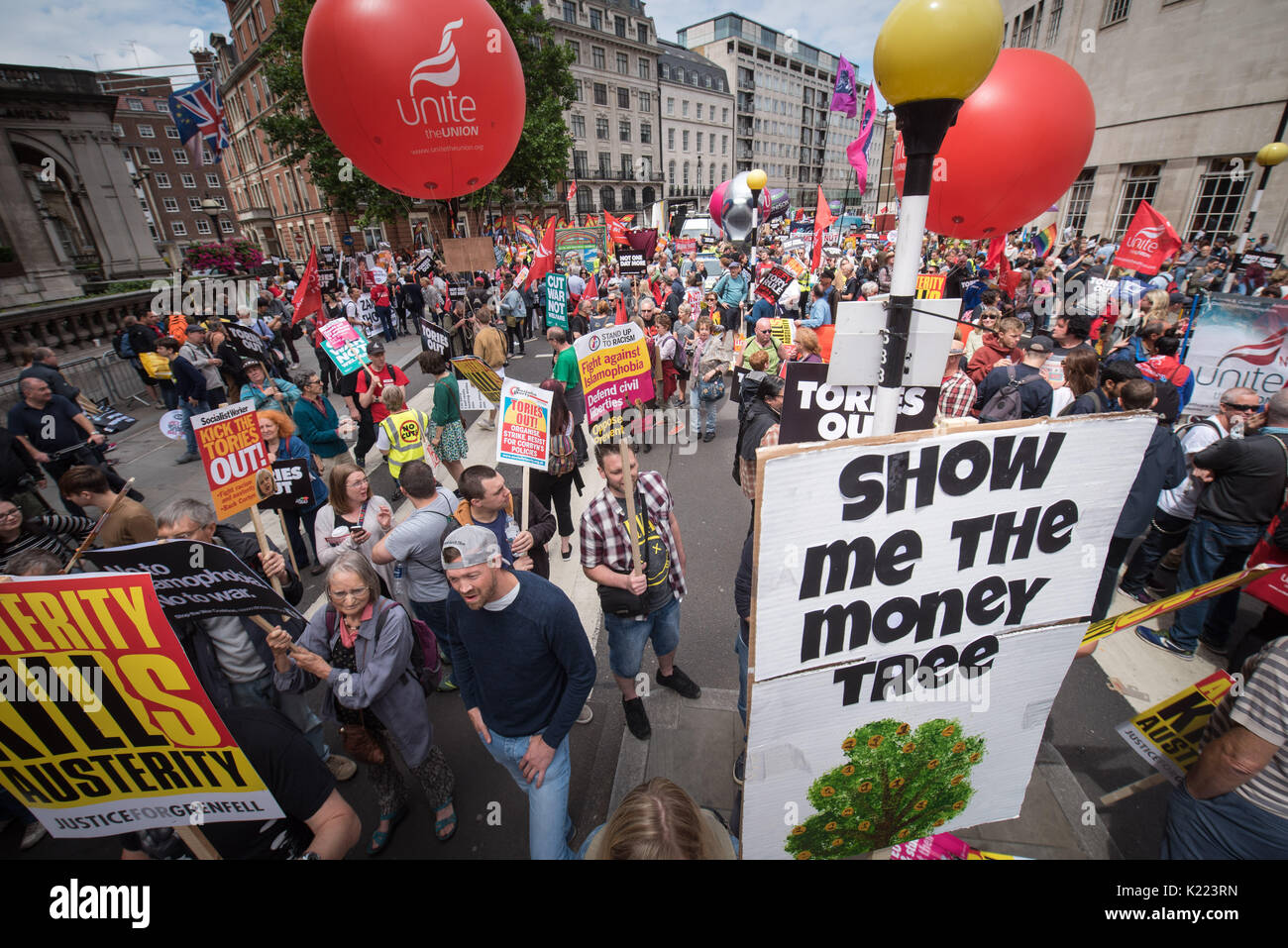 London, UK. 1st July 2017. Pictured: Protesters gather at BBC Portland Place before the start of the march.  / Several thousand protesters take to the Stock Photo