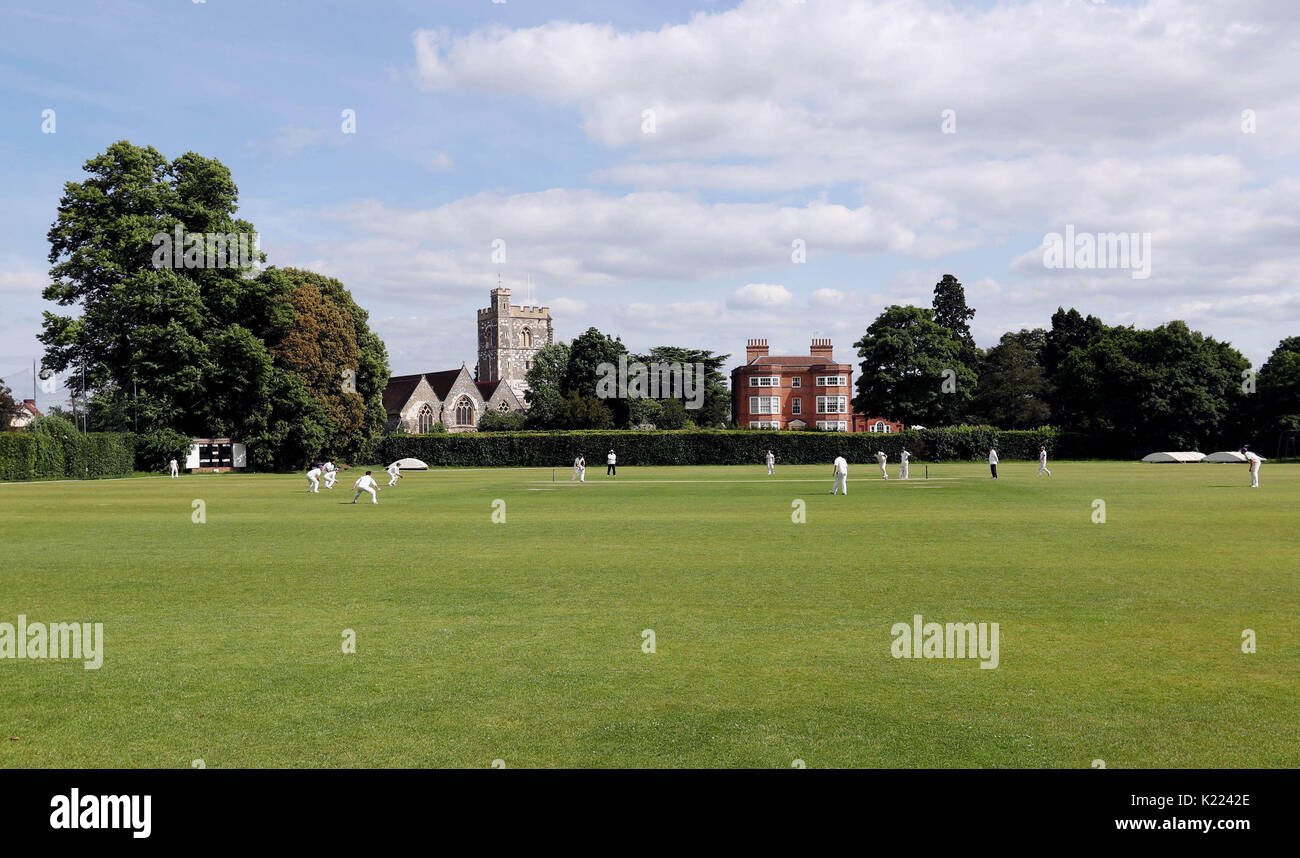 The view from the upper floor of the pavilion showing St. Michael's Church (left) and the Dower House (right) as a match takes place at Maidenhead and Bray cricket Club in Berkshire on Saturday June 3, 2017. Stock Photo