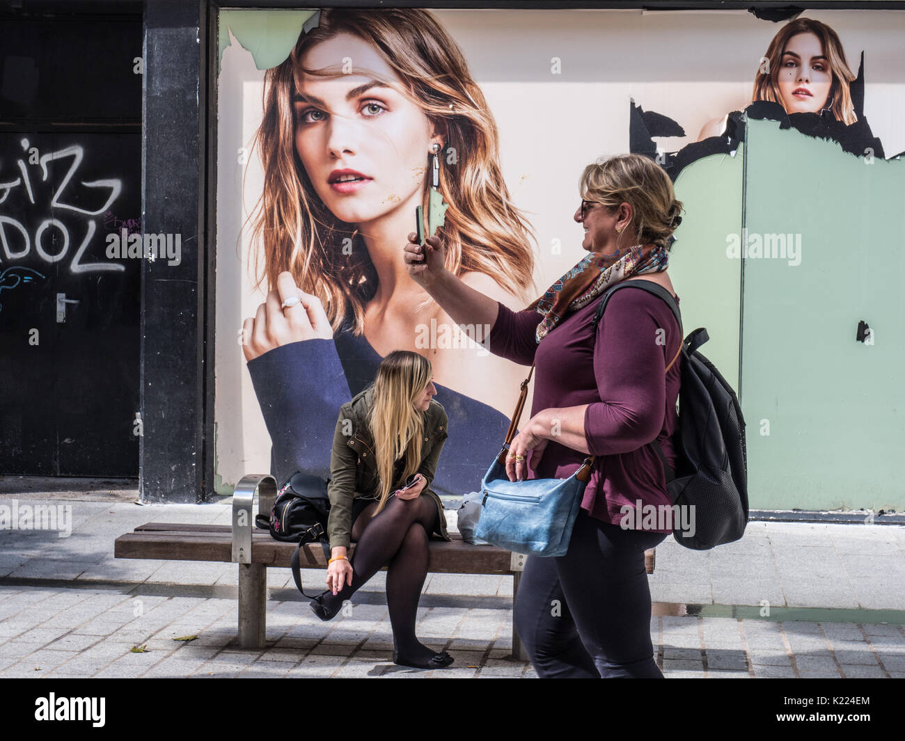 Woman taking selfie in street, Liverpool, England, UK Stock Photo