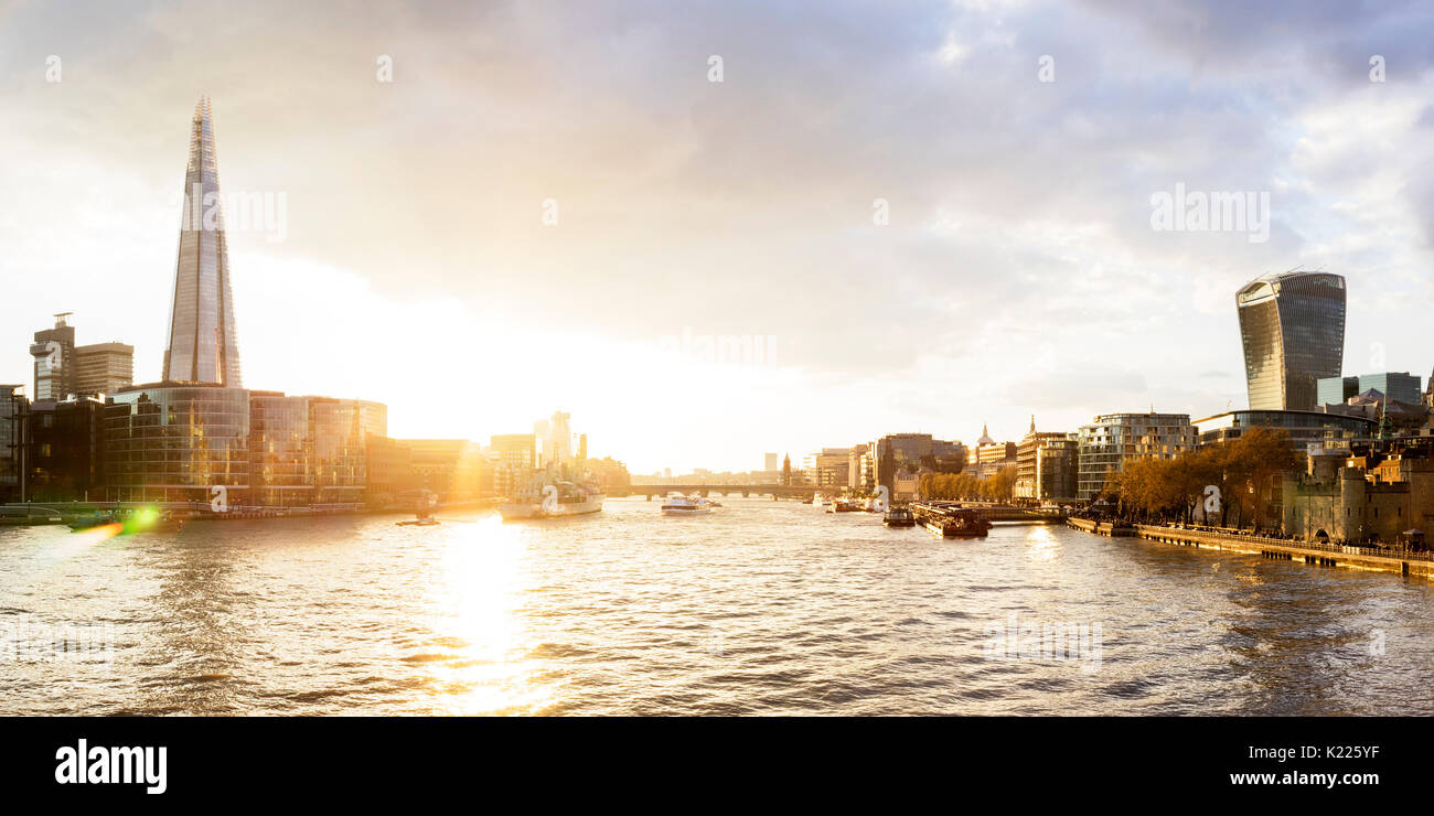 UK, London, Dramatic sky over the city skyline and River Thames at sunset, with view of the Shard and the Walkie Talkie tower Stock Photo