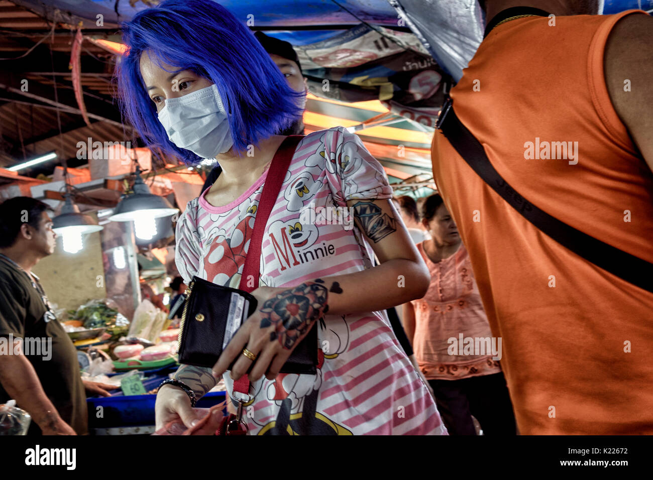 Woman blue hair and tattoos. Fashion Conscious Asian youth. Thailand Southeast Asia. Extreme colored hair Stock Photo