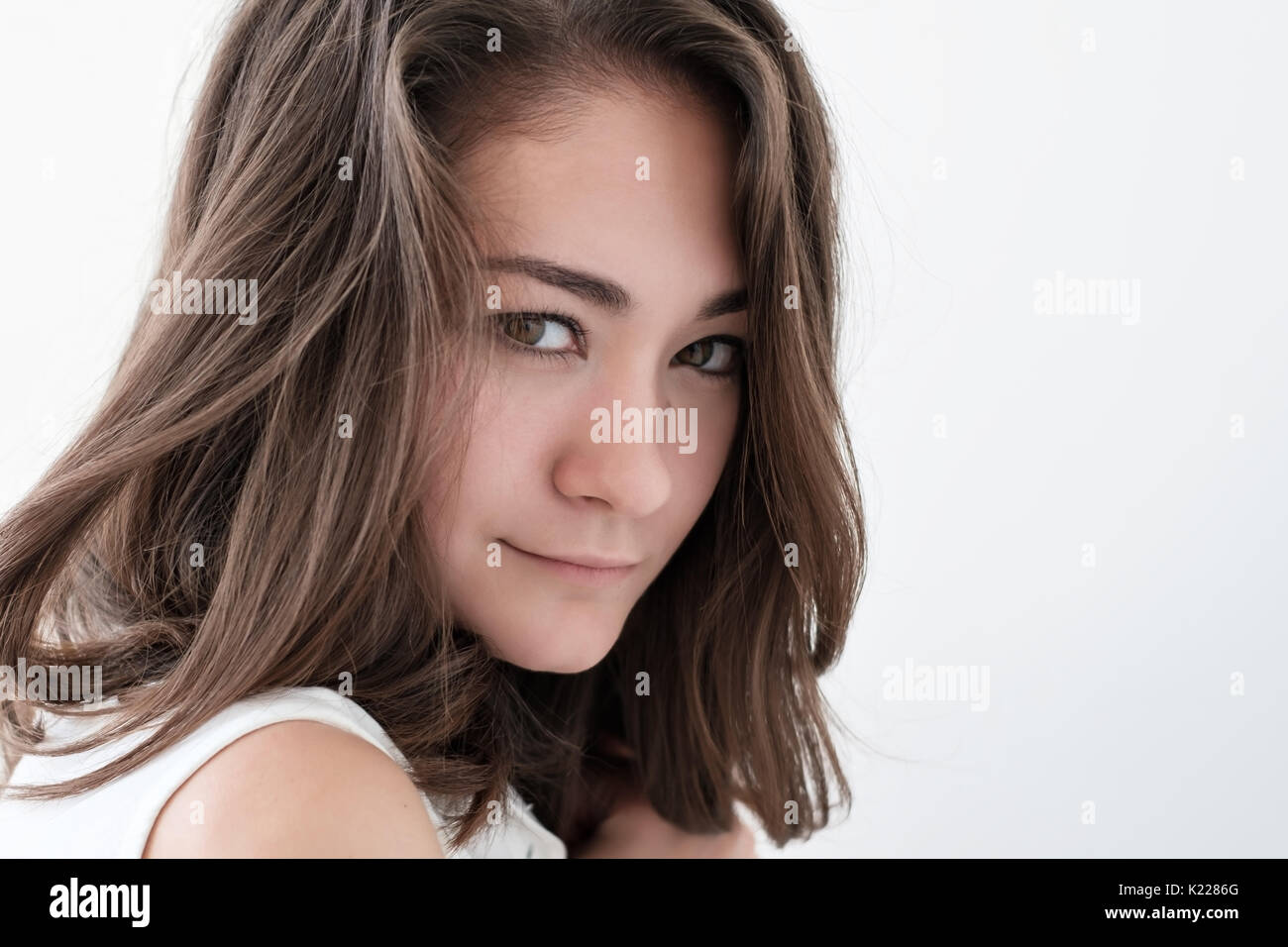 Teen girl portrait, over white background Stock Photo