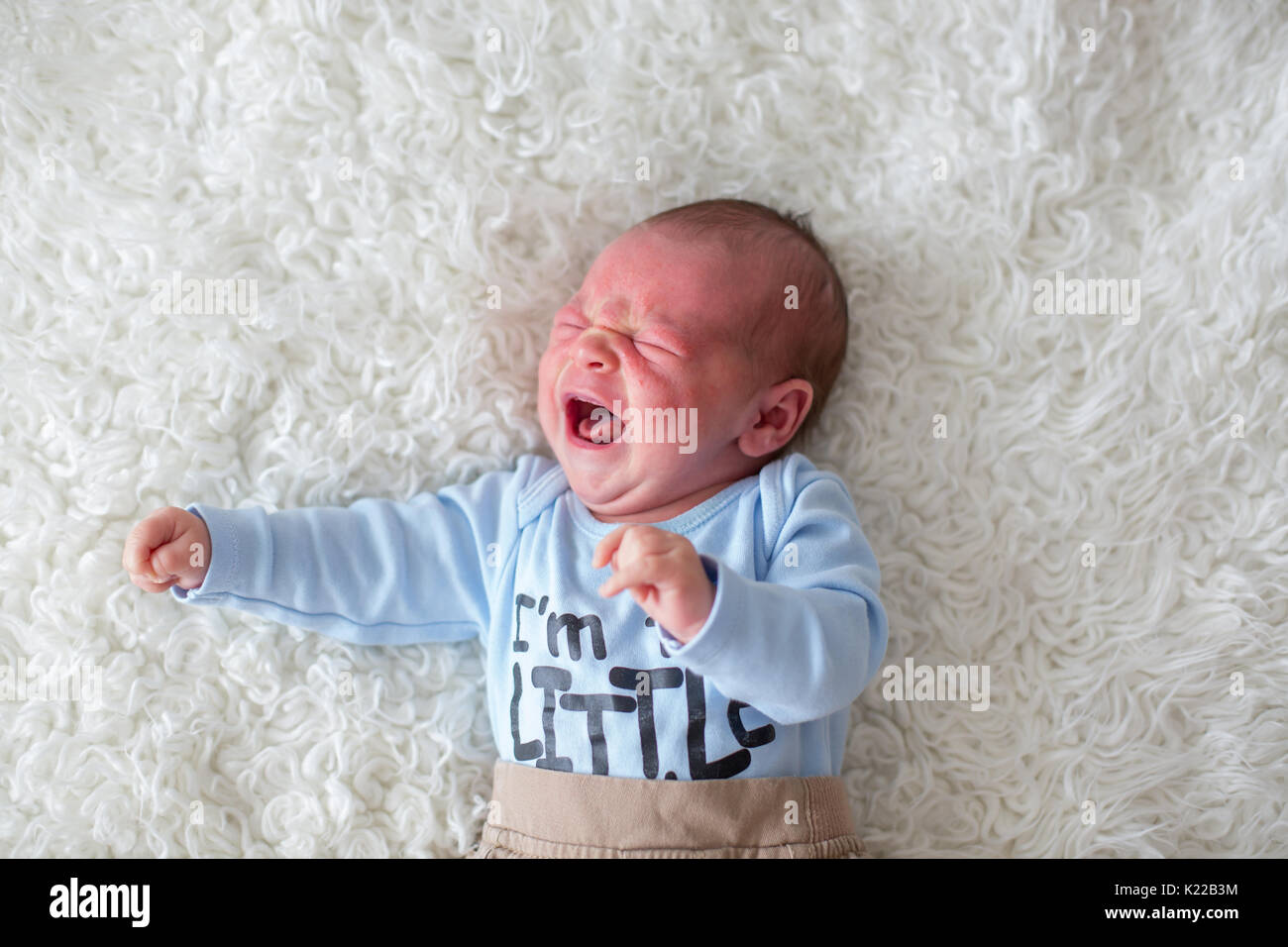 Little newborn baby crying, baby with skin rash, child dermatitis symptom problem rash, newborn