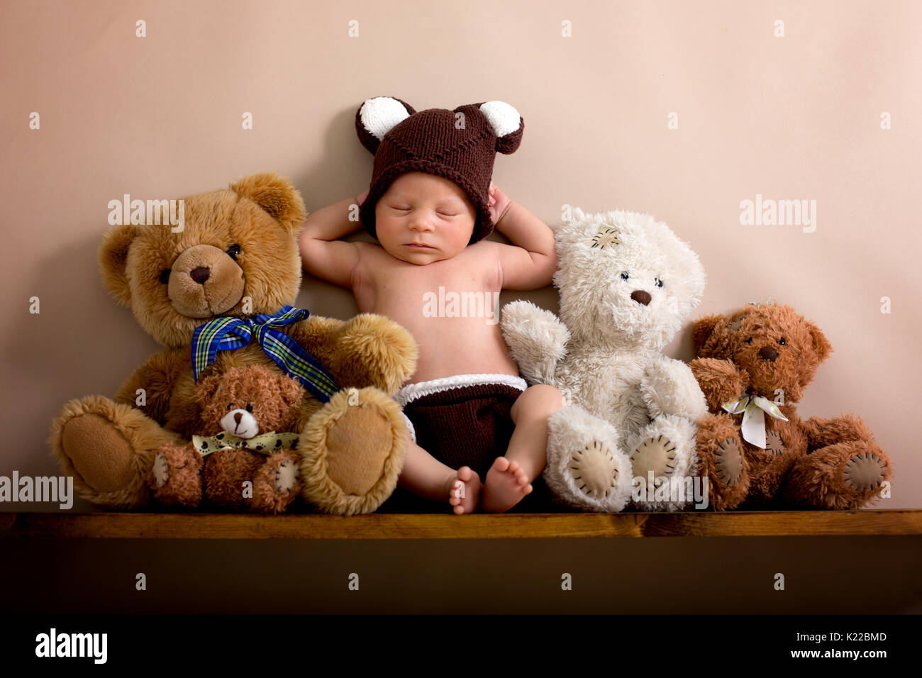 Newborn baby boy wearing a brown 