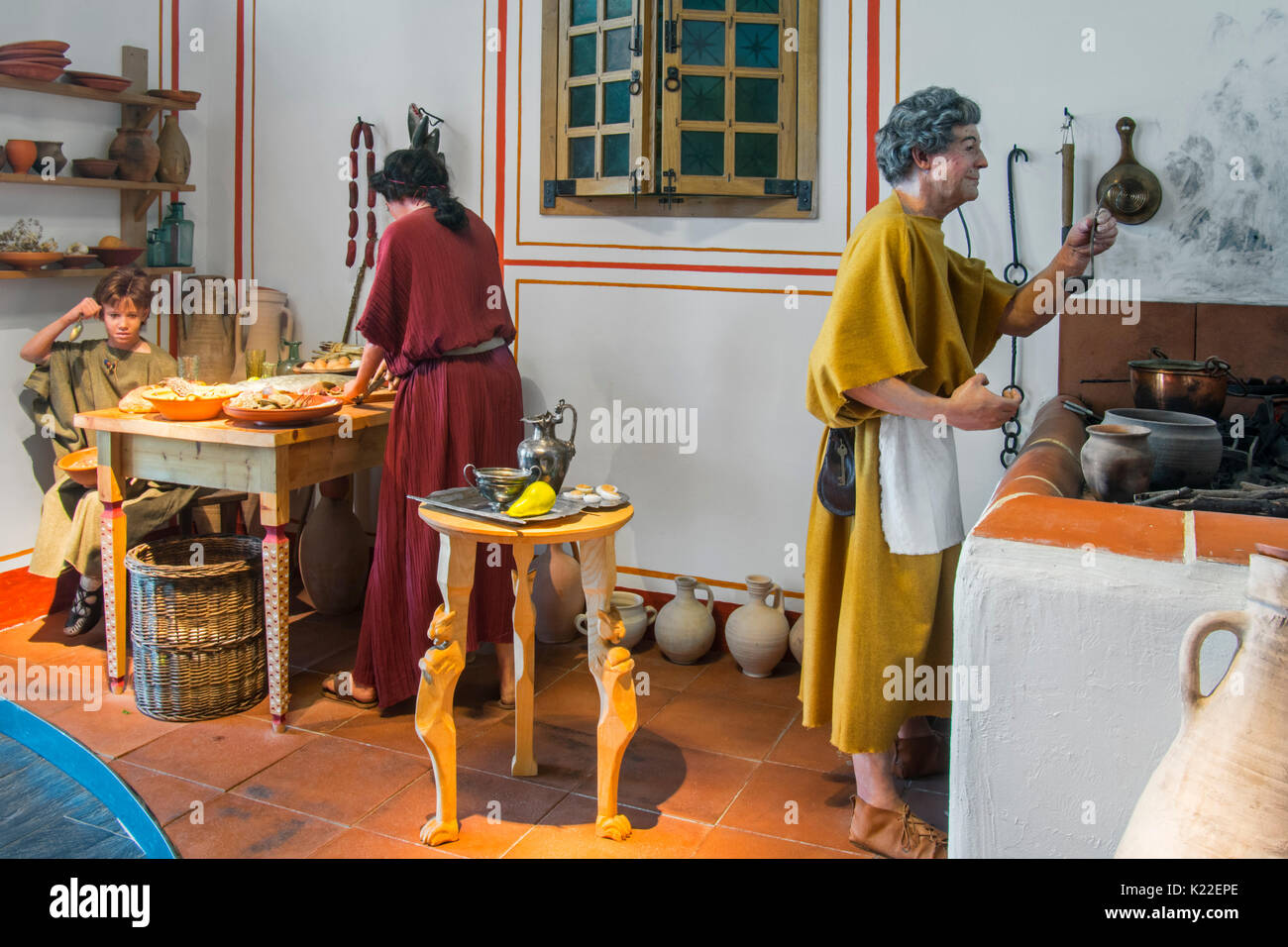 Diorama showing life-size figures depicting daily life in the kitchen of a Roman villa, Echternach, Luxembourg Stock Photo