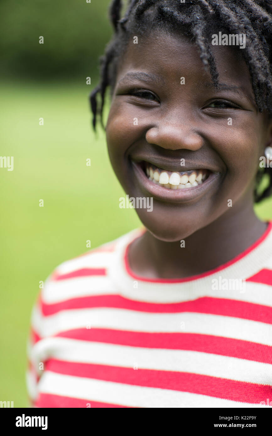 Outdoor Portrait Of Smiling Teenage Girl Stock Photo