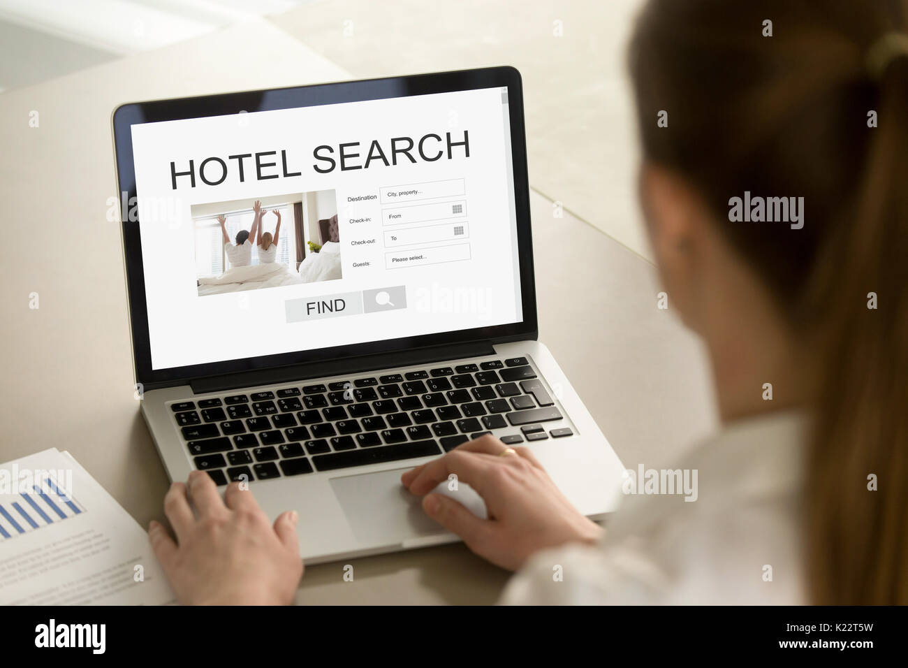 Woman choosing hotel online, using travel booking application se Stock Photo