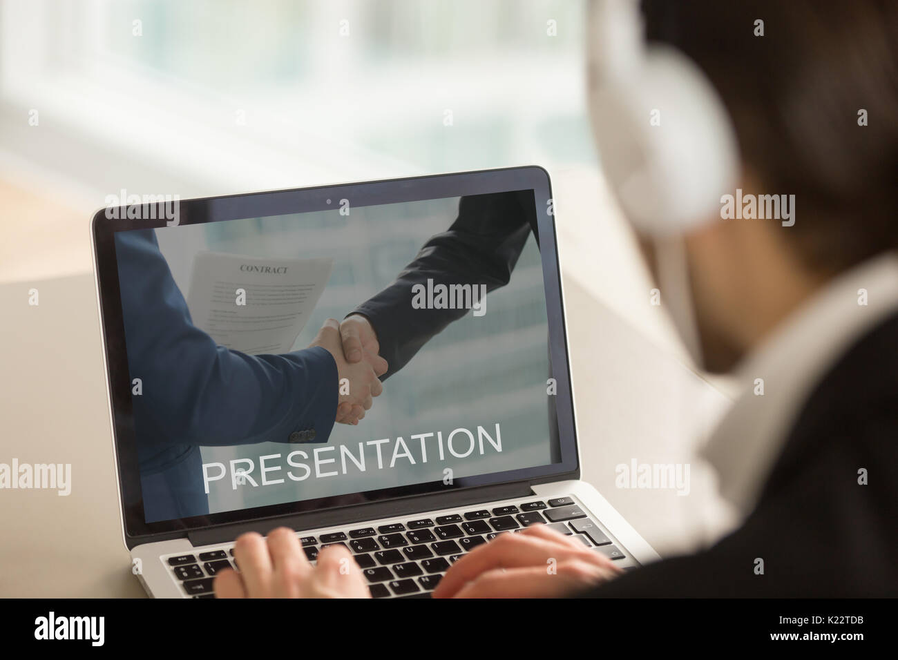 Businessman watching business presentation, looking at laptop sc Stock Photo