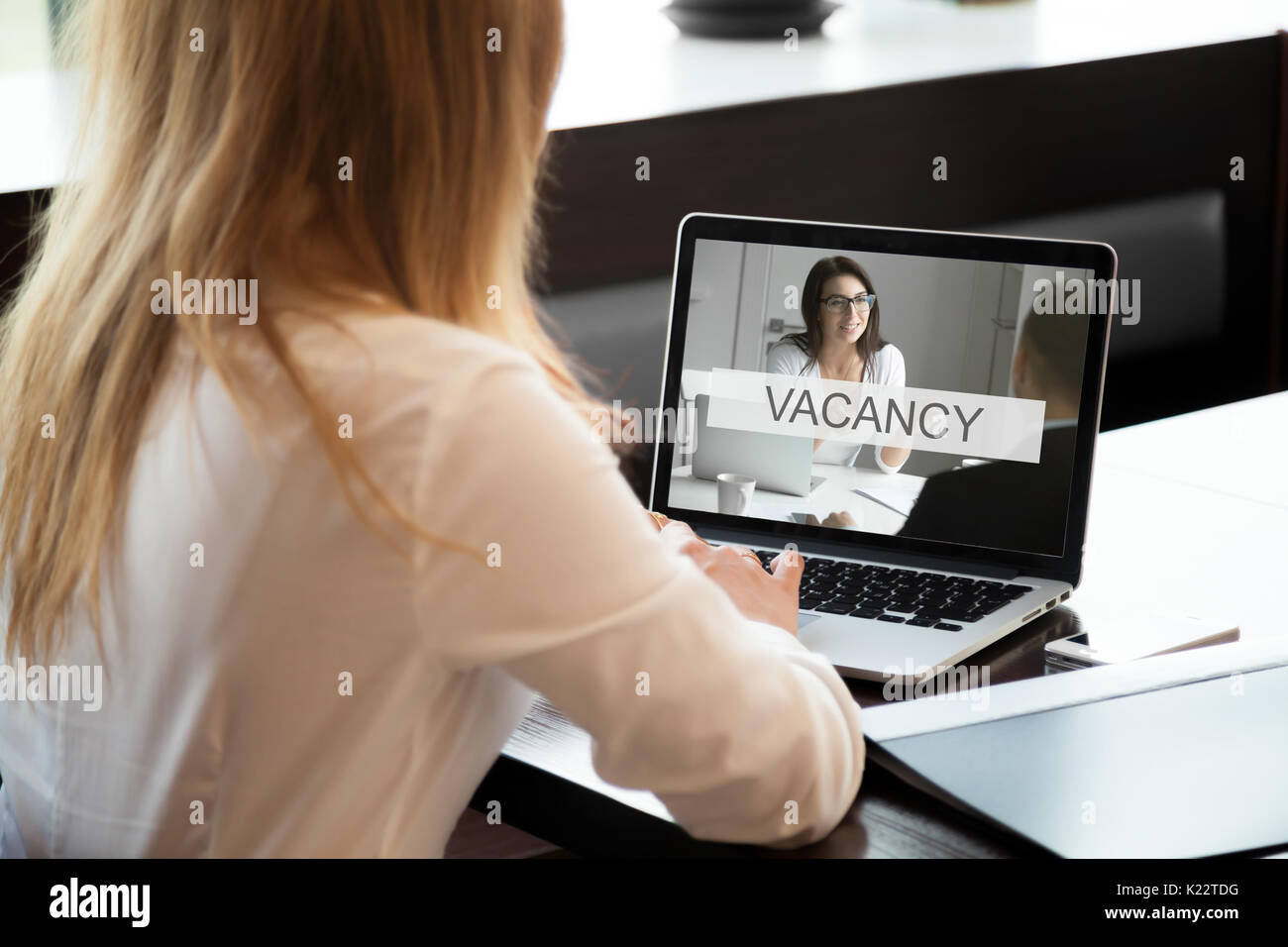 HR manager opens available company vacancy, job offer online, cl Stock Photo