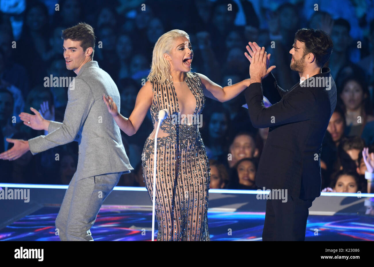 Bebe Rexha and The Chainsmokers presenting on stage during the 2017 MTV Video Music Awards held at The Forum in Los Angeles, USA. Stock Photo