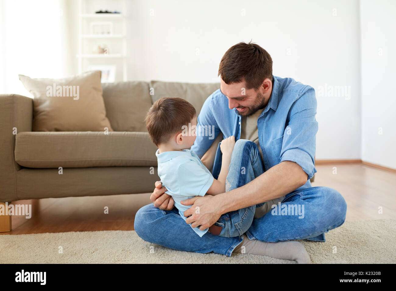 father with son playing and having fun at home Stock Photo