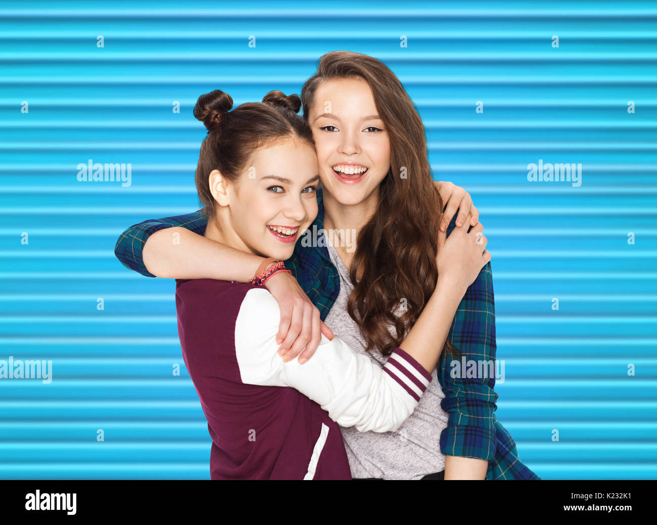 happy smiling pretty teenage girls hugging Stock Photo - Alamy